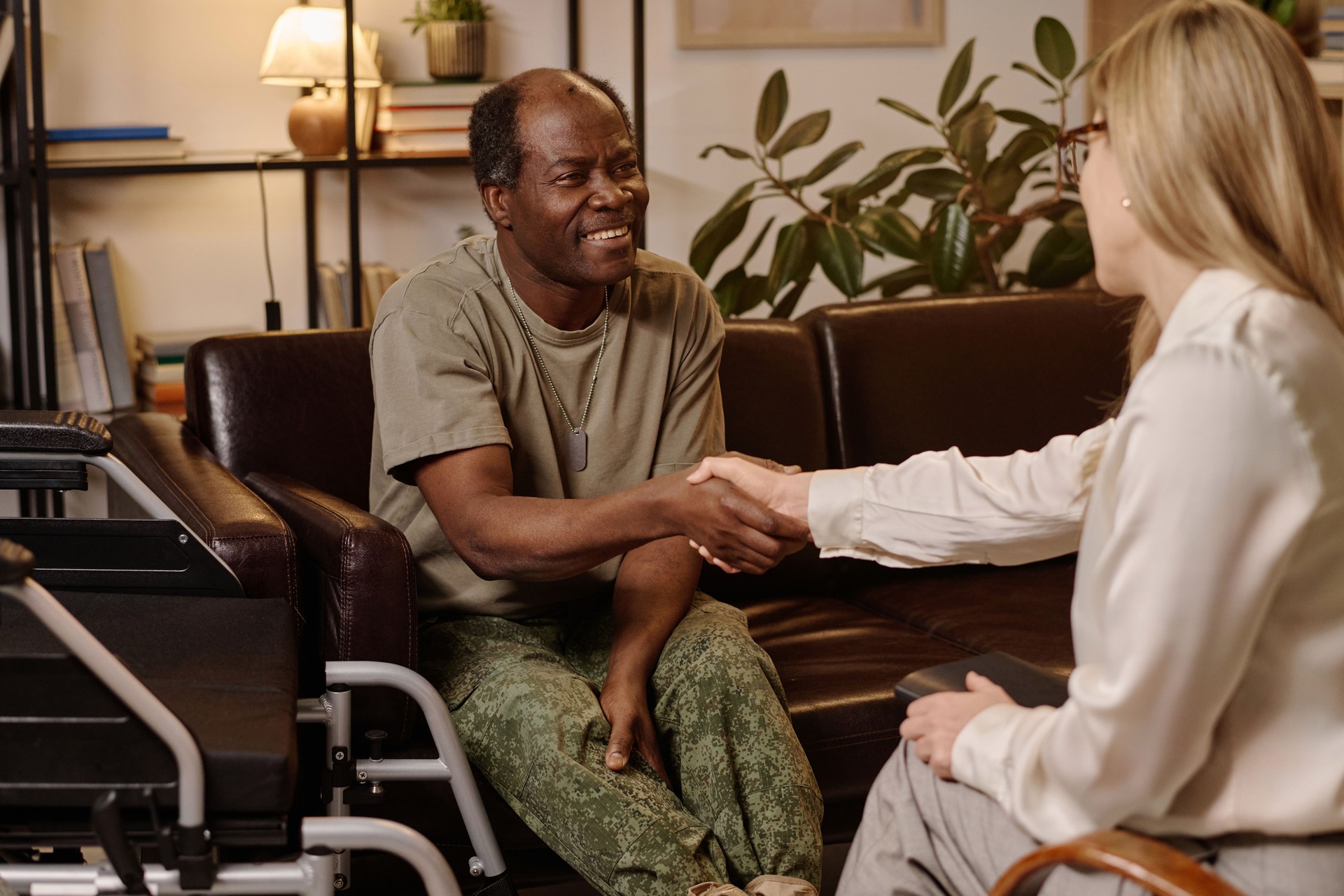 Thankful African American War Veteran Shaking Hands with His Therapist